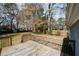 Wooden deck overlooking a large, fenced backyard with trees at 5760 Lakeview Dr, Powder Springs, GA 30127