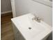 Close-up of a white bathroom sink and brushed nickel faucet at 5760 Lakeview Dr, Powder Springs, GA 30127