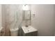 Bathroom with marble-look tile, a vanity sink, and a toilet at 5760 Lakeview Dr, Powder Springs, GA 30127