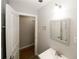 Bathroom vanity with a sink, mirror, and light fixture at 5760 Lakeview Dr, Powder Springs, GA 30127