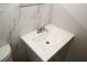 Close-up of a bathroom vanity with modern fixtures and marble-look tile at 5760 Lakeview Dr, Powder Springs, GA 30127