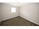 Empty bedroom with neutral walls and carpeting at 5760 Lakeview Dr, Powder Springs, GA 30127