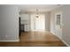 Dining room with white cabinetry, wood-look flooring, and sliding glass doors to backyard at 5760 Lakeview Dr, Powder Springs, GA 30127