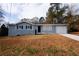 Charming single-story home with a gray exterior and white trim at 5760 Lakeview Dr, Powder Springs, GA 30127