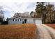 Charming single-story home with a driveway, attached garage, and front yard at 5760 Lakeview Dr, Powder Springs, GA 30127
