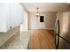 Bright kitchen with white cabinetry, granite countertops, and light wood-look flooring at 5760 Lakeview Dr, Powder Springs, GA 30127