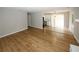 Living room with wood floors, a fireplace, and access to the kitchen and dining area at 5760 Lakeview Dr, Powder Springs, GA 30127