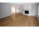 Spacious living room with wood-look flooring, a fireplace, and large windows at 5760 Lakeview Dr, Powder Springs, GA 30127