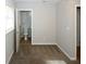 Main bedroom with attached bathroom and plush carpeting at 5760 Lakeview Dr, Powder Springs, GA 30127