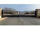 Gated community entrance with decorative iron gates at 849 Lakemont Dr, Canton, GA 30114
