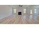 Open living room with fireplace and hardwood floors at 200 Haverling Pass, Hampton, GA 30228