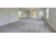 Spacious main bedroom with carpet, ensuite bathroom, and upper level access at 200 Haverling Pass, Hampton, GA 30228