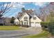 Two-story house with a three car garage and manicured lawn at 4498 Avion Park, Douglasville, GA 30135