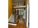 Two-story foyer with hardwood floors, iron railings, and open floor plan at 1151 Gulfport Run, Grayson, GA 30017