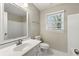 Clean bathroom with white vanity and a bathtub at 951 David Dr, Lawrenceville, GA 30046