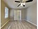 Spacious bedroom with ceiling fan and access to upper loft at 951 David Dr, Lawrenceville, GA 30046