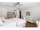 Bright bedroom with a pink and white color scheme and hardwood floors at 108 Trinity Hollow Drive, Canton, GA 30115