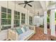 Relaxing porch swing on a brick patio at 108 Trinity Hollow Drive, Canton, GA 30115