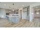 Modern kitchen with gray cabinets, large island, and quartz countertops at 165 Haverling Pass, Hampton, GA 30228