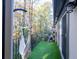 Private balcony with artificial turf and hanging chair at 6851 Roswell Rd # I18, Sandy Springs, GA 30328