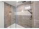 Updated bathroom with a glass shower enclosure and modern tile at 6851 Roswell Rd # I18, Sandy Springs, GA 30328