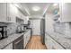 Modern kitchen featuring white cabinets and granite countertops at 6851 Roswell Rd # I18, Sandy Springs, GA 30328