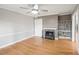 Light-filled living room with hardwood floors and fireplace at 6851 Roswell Rd # I18, Sandy Springs, GA 30328