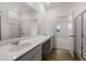 Double sink bathroom with grey cabinets and a walk-in shower at 2295 Treaty Ln, Douglasville, GA 30135