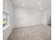 Simple bedroom with neutral wall paint and carpeted floors at 2295 Treaty Ln, Douglasville, GA 30135