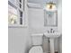 Updated bathroom with white subway tile and pedestal sink at 111 Charles Pl, Cumming, GA 30040