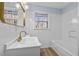 Updated bathroom with white subway tile and bathtub at 111 Charles Pl, Cumming, GA 30040