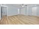 Large bedroom with hardwood floors and multiple doors at 111 Charles Pl, Cumming, GA 30040