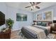 Bright bedroom with hardwood floors and ceiling fan at 111 Charles Pl, Cumming, GA 30040