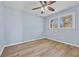 Spacious bedroom with light blue walls and wood-look flooring at 111 Charles Pl, Cumming, GA 30040