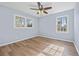 Spacious bedroom with light blue walls and wood-look flooring at 111 Charles Pl, Cumming, GA 30040