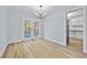 Bright dining room with hardwood floors and french doors at 111 Charles Pl, Cumming, GA 30040