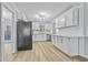 Modern kitchen with white cabinets and marble countertops at 111 Charles Pl, Cumming, GA 30040