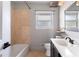 Updated bathroom with beige tile and a dark vanity at 2289 Lyle Rd, Atlanta, GA 30337