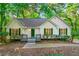 White house with green shutters, deck, and landscaped yard at 3684 Regent Nw Dr, Kennesaw, GA 30144