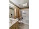 Accessible bathroom featuring a walk-in shower and grab bars at 1845 Branch Valley Dr, Roswell, GA 30076