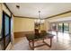 Dining room with a dark granite table and hardwood floors at 1845 Branch Valley Dr, Roswell, GA 30076
