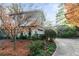 House exterior showcasing stone accents and a driveway at 1845 Branch Valley Dr, Roswell, GA 30076