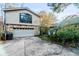 View of the house's garage and partial exterior at 1845 Branch Valley Dr, Roswell, GA 30076