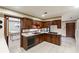 Spacious kitchen featuring wood cabinets, tile flooring, and ample counter space at 1845 Branch Valley Dr, Roswell, GA 30076