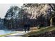Couple strolls along a paved lakeside path at 1845 Branch Valley Dr, Roswell, GA 30076