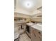 Laundry area with washer, dryer, and built-in shelving at 1845 Branch Valley Dr, Roswell, GA 30076