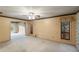 Living room featuring carpeting, ceiling fan, and access to patio at 1845 Branch Valley Dr, Roswell, GA 30076