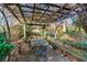 Rustic pergola with seating and table, perfect for outdoor dining at 1845 Branch Valley Dr, Roswell, GA 30076