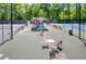 Community tennis courts with seating and shaded areas at 1845 Branch Valley Dr, Roswell, GA 30076