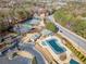 Aerial view of community with pool, tennis courts, and playground at 3025 Lexington Ave, Woodstock, GA 30189